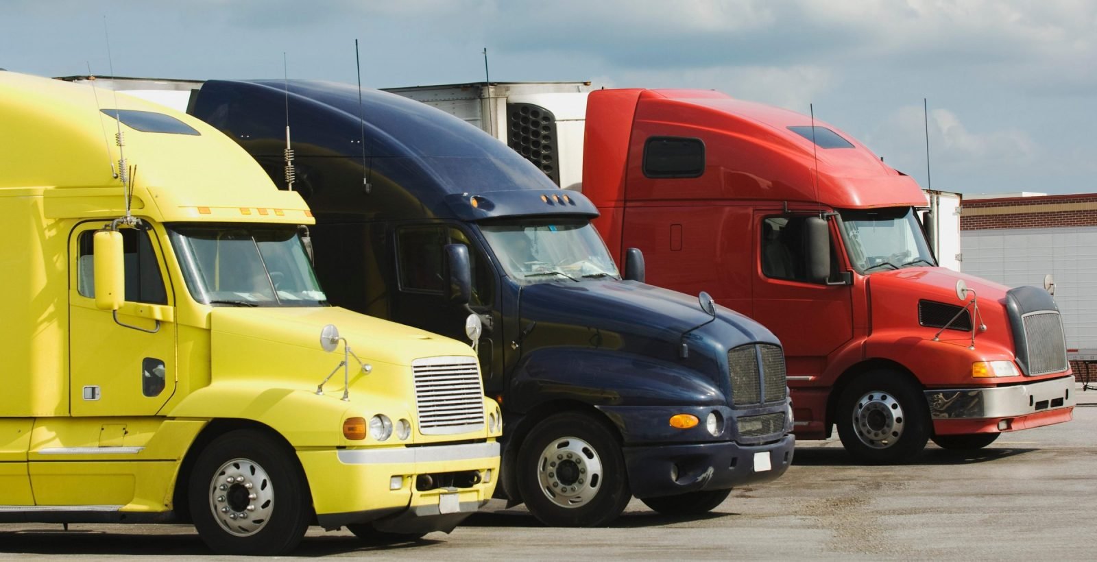 Tractor units of several fleets parked side by side