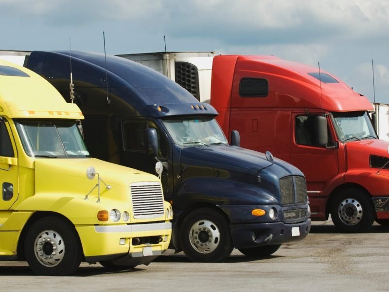Tractor units of several fleets parked side by side